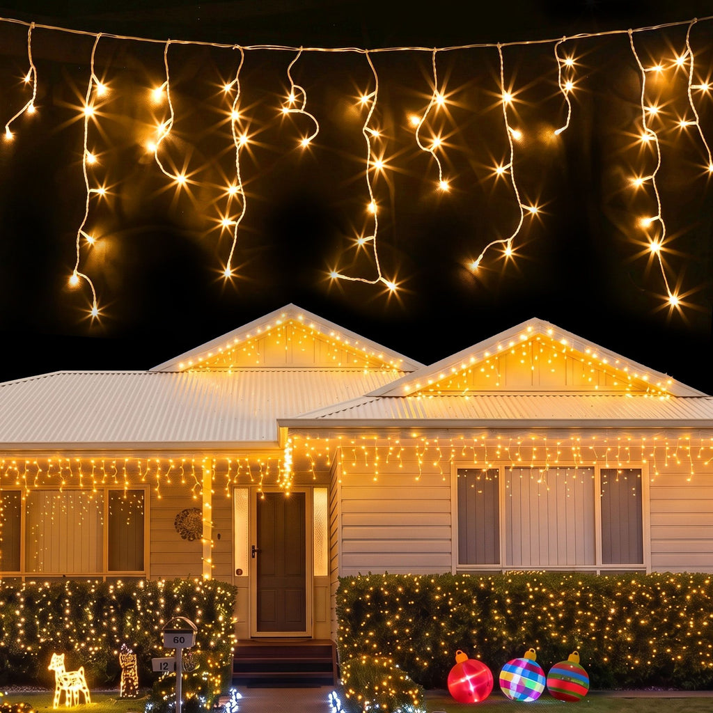 12.5m 500-LED Solar Christmas Icicle Lights Warm White - Illuminated Night-Time Outdoor Display View